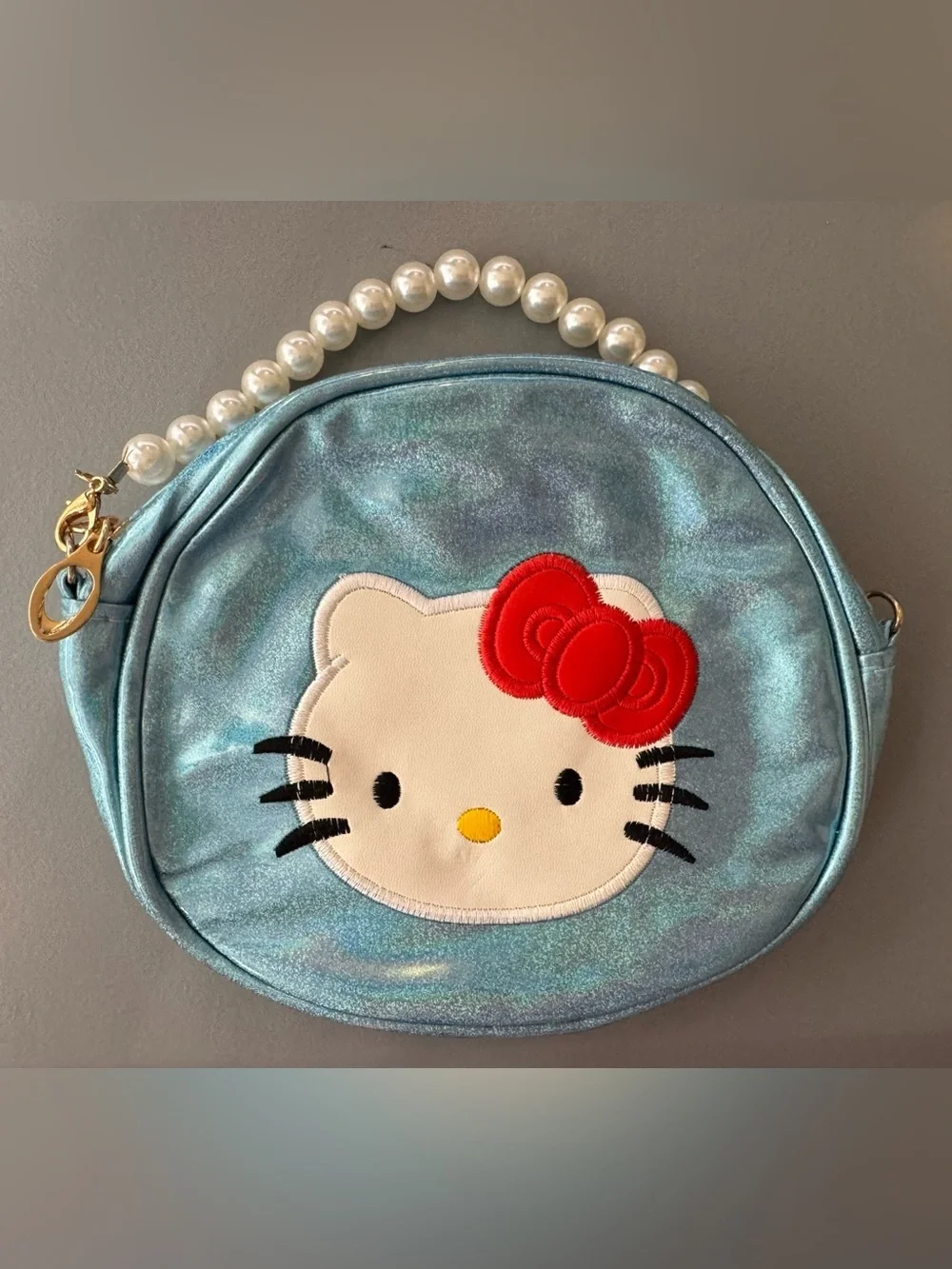 Hello Kitty Shimmery Light Blue Pearl-Handle Kids Crossbody Bag w/ Red Bow